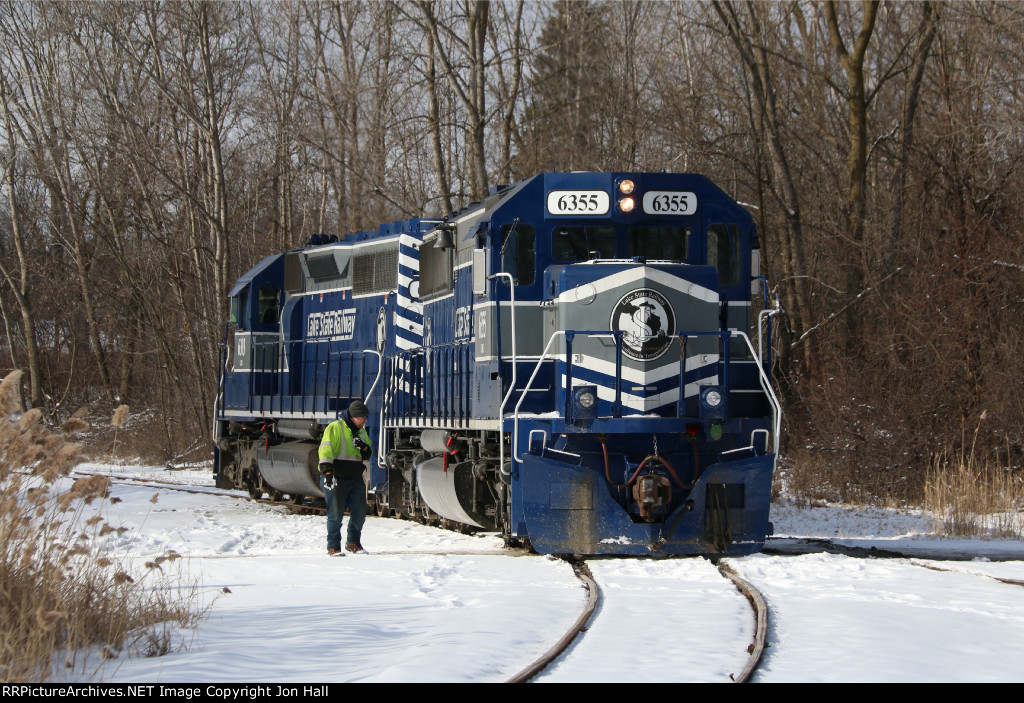 The conductor watches closely as 6355 cuts through the ice packed flangeways